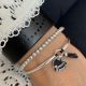 Bracelet demi jonc coeur et pompon